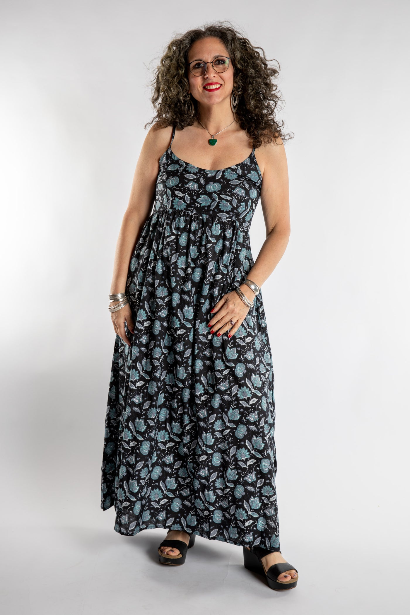Susan is wearing the Sundara Cotton Maxi Dress in Black in M/L