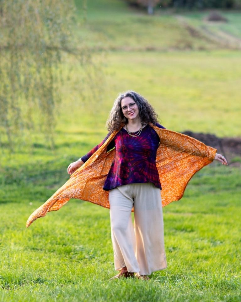 Susan wearing the crinkle dyed vest, tie dye top, and penny lane pants
