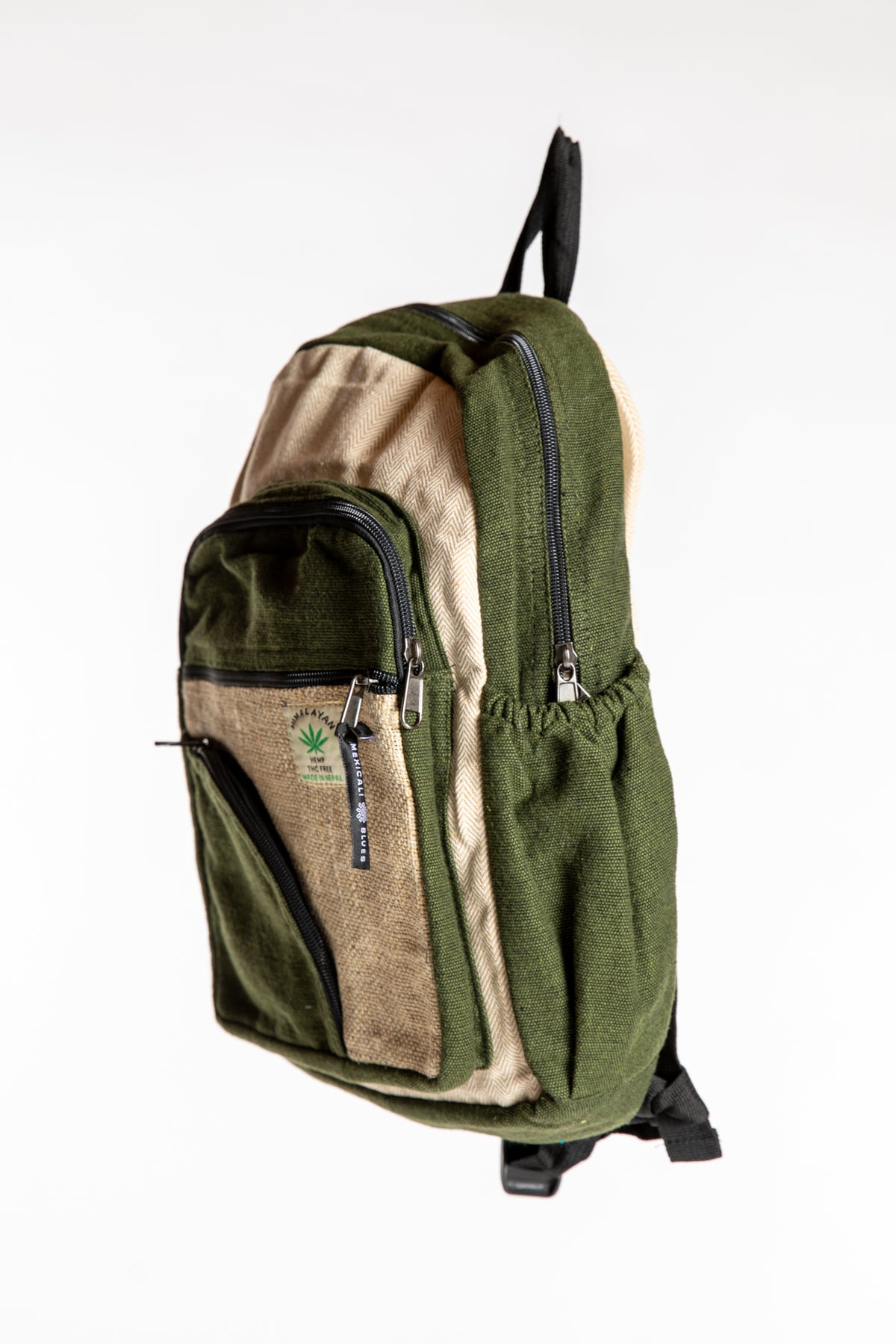Side view of green and cream hemp backpack showing side pocket and backpack straps