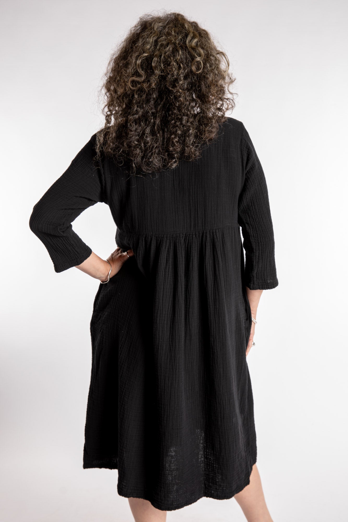 Susan is wearing the Tashi Cotton Day Dress in Black L/XL
