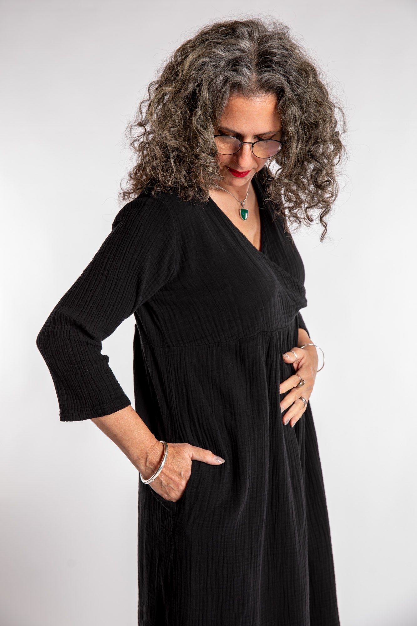 Susan is wearing the Tashi Cotton Day Dress in Black L/XL