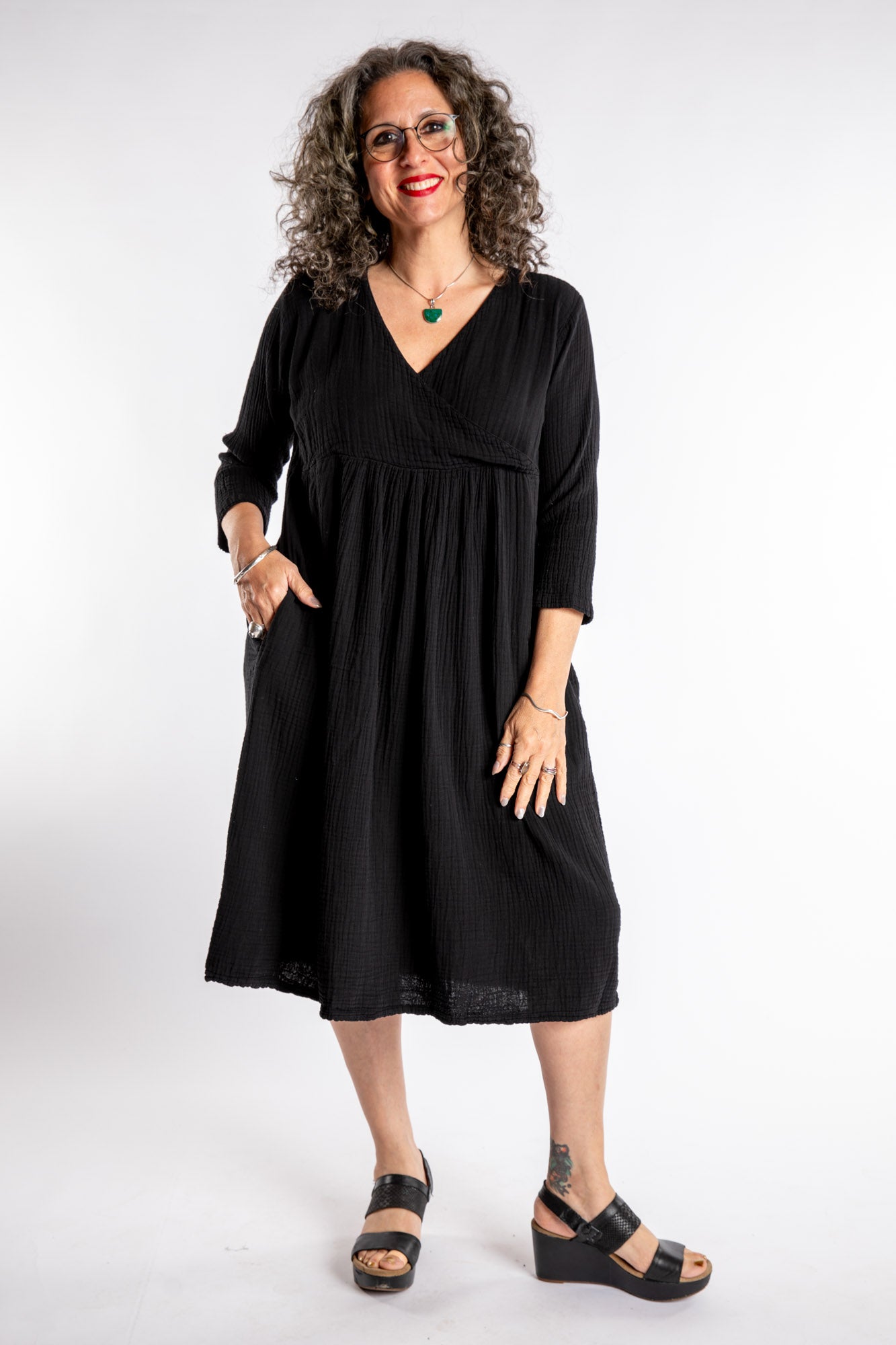 Susan is wearing the Tashi Cotton Day Dress in Black L/XL
