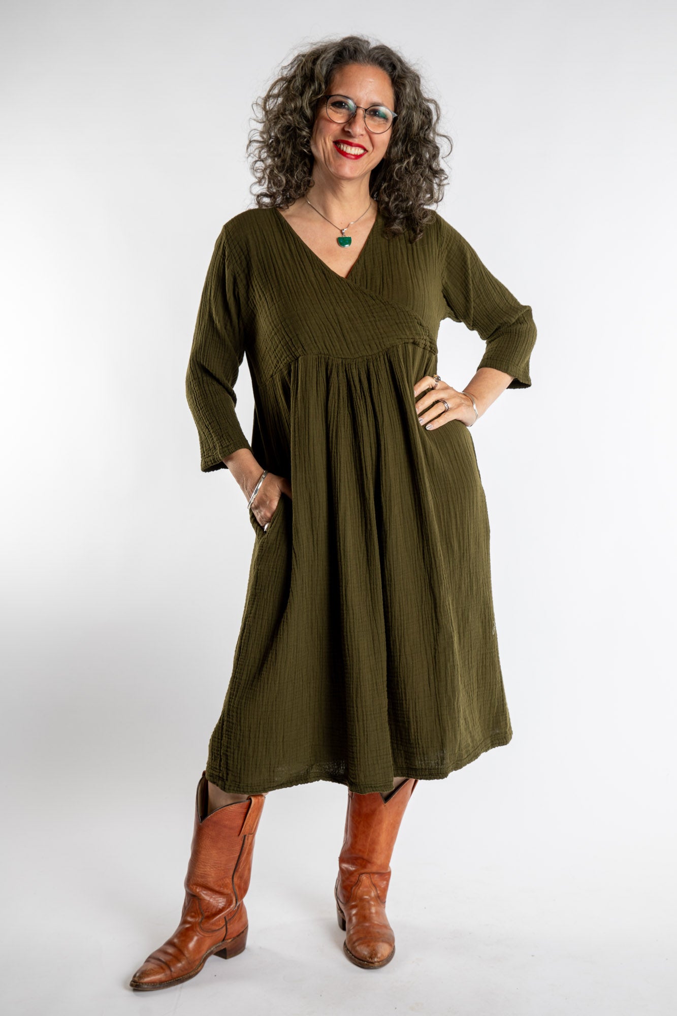 Susan is wearing the Tashi Cotton Day Dress in Olive L/XL