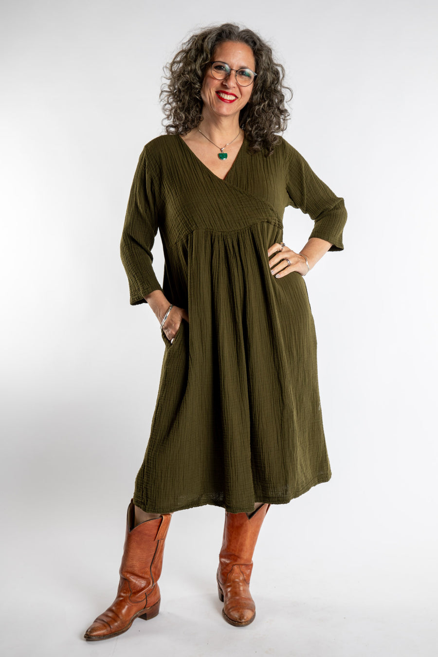 Susan is wearing the Tashi Cotton Day Dress in Olive L/XL