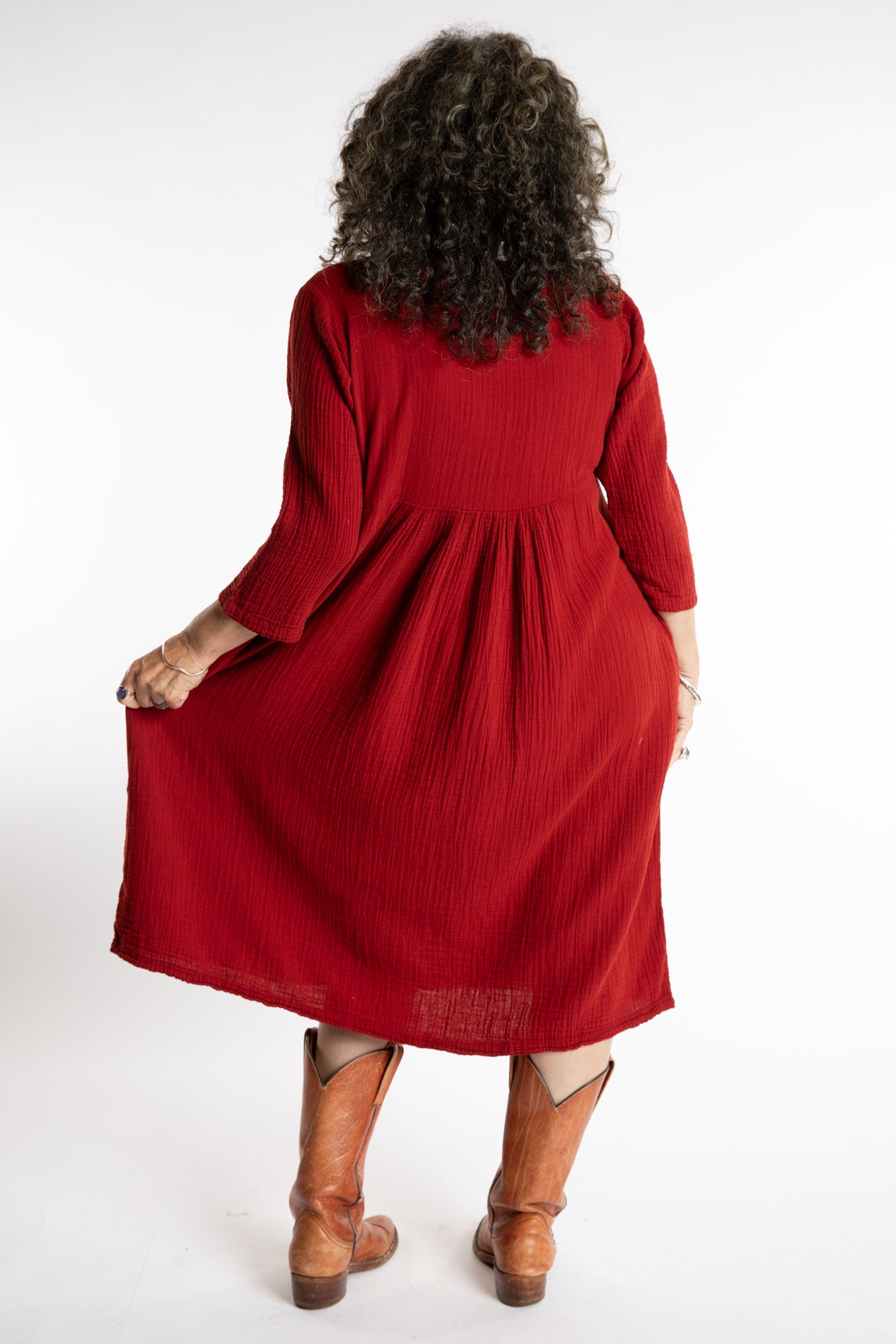 Susan is wearing the Tashi Cotton Day Dress in Paprika L/XL