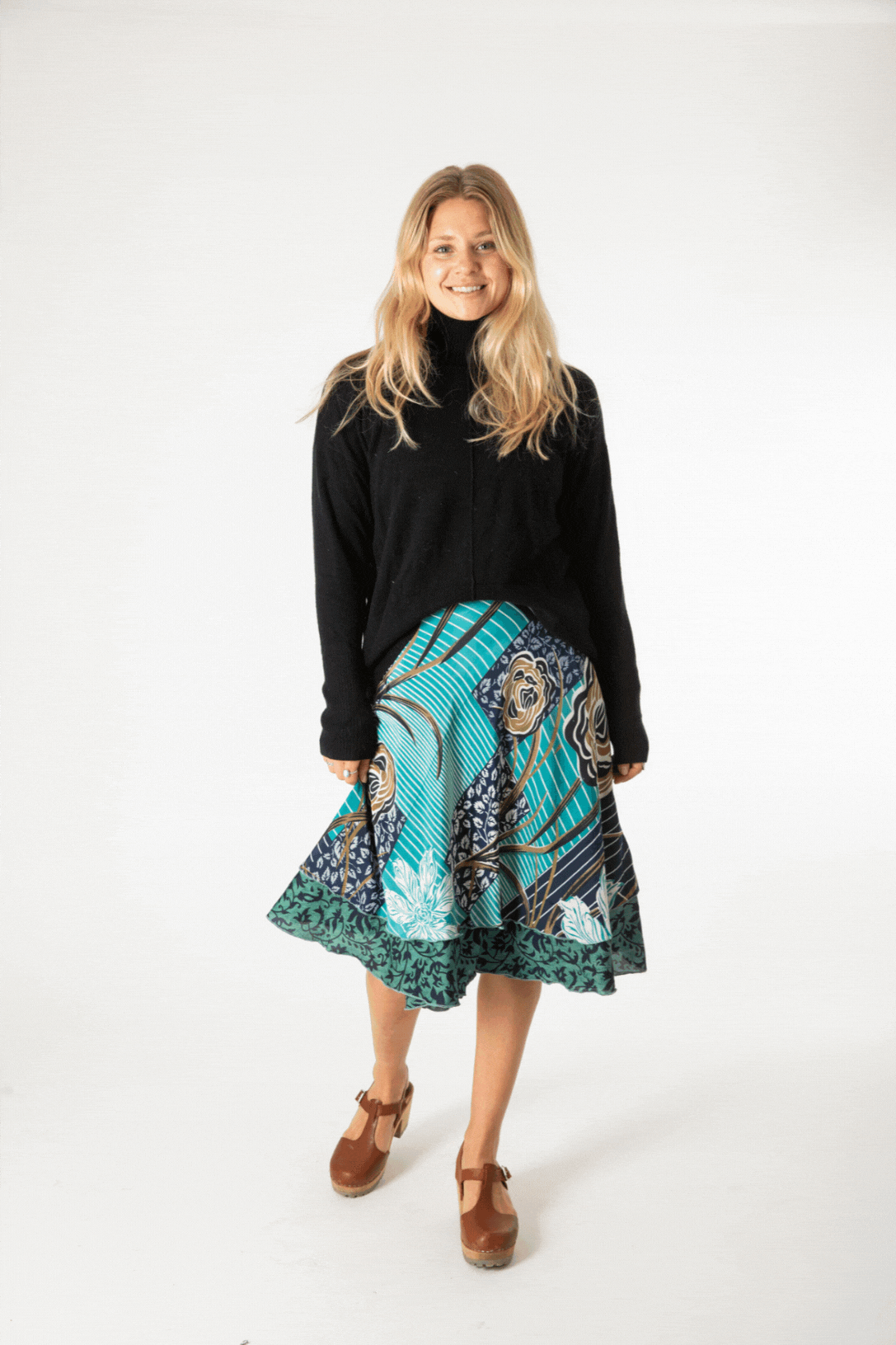 Sophie is wearing a silk wrap skirt in morning dew 