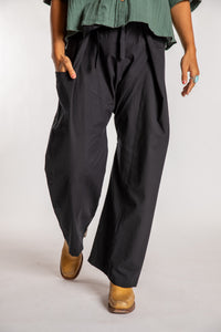 Sophie is wearing the Black Thai Fisherman Pocket Pants 