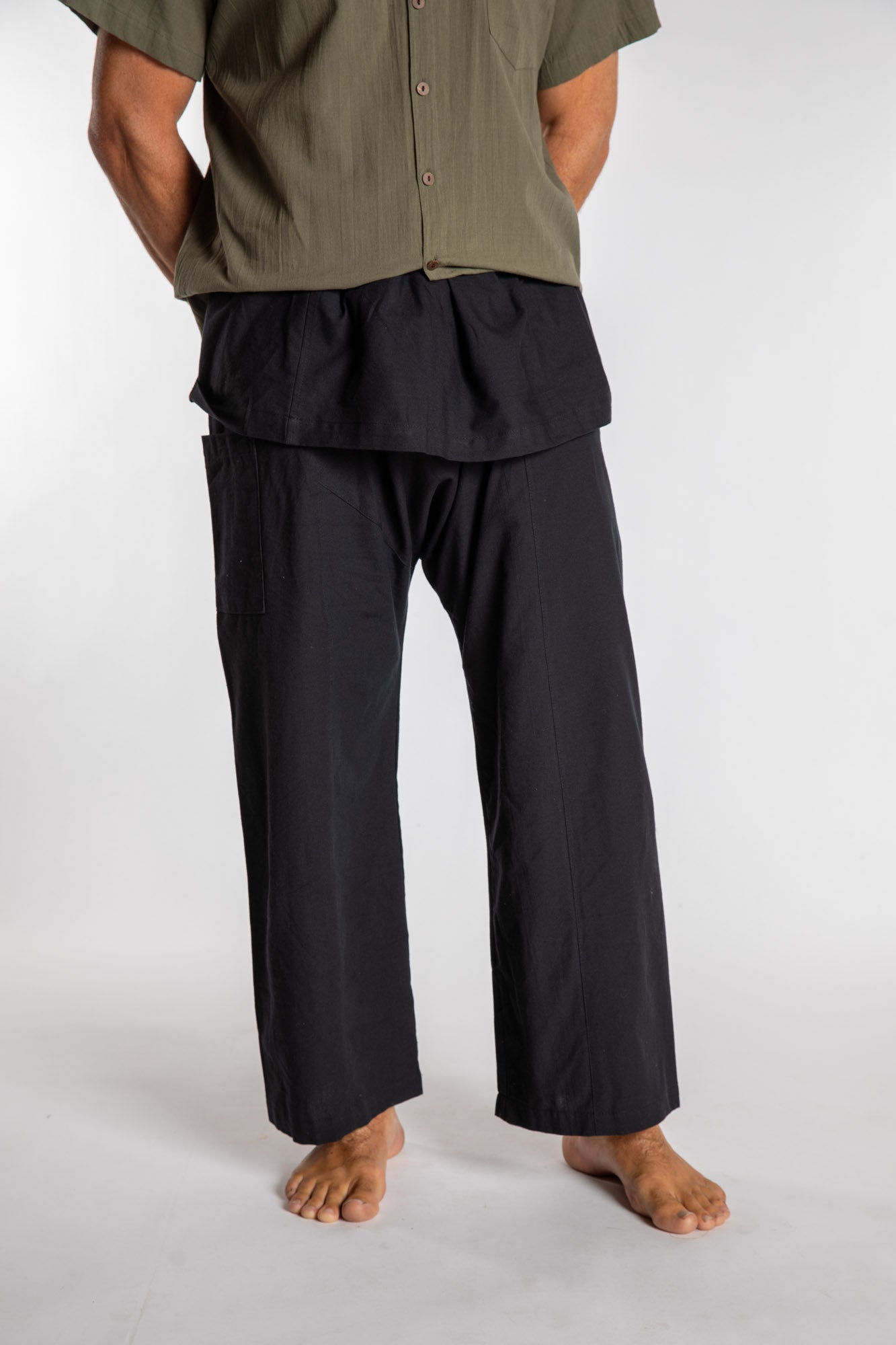 Topher is wearing the Black Thai Fisherman Pocket Pants 
