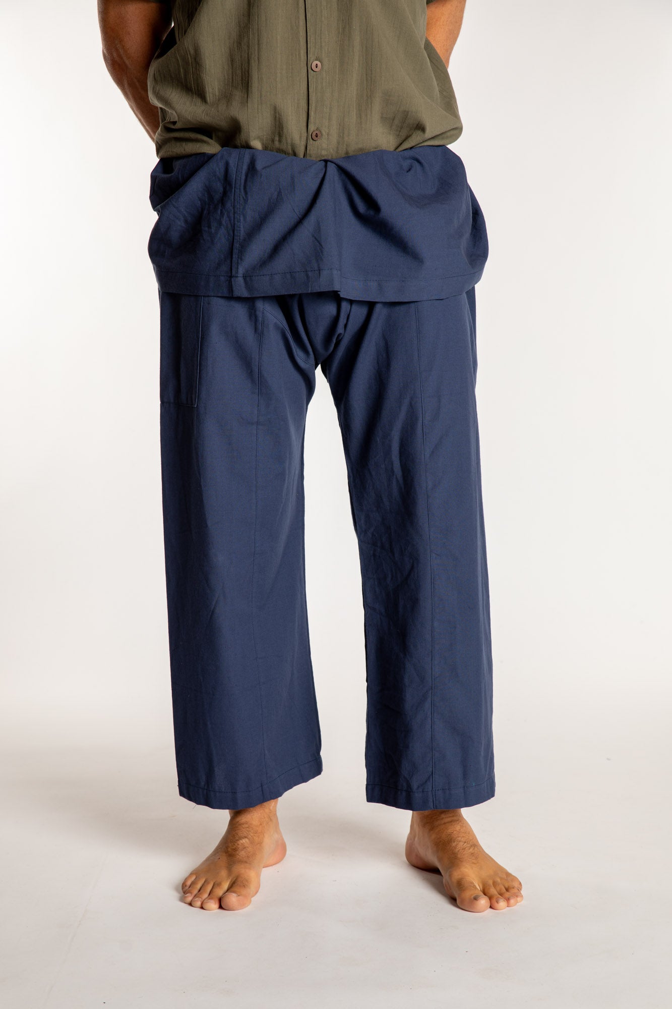 Topher is wearing the Dark Blue Thai Fisherman Pocket Pants 