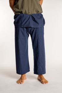 Topher is wearing the Dark Blue Thai Fisherman Pocket Pants 
