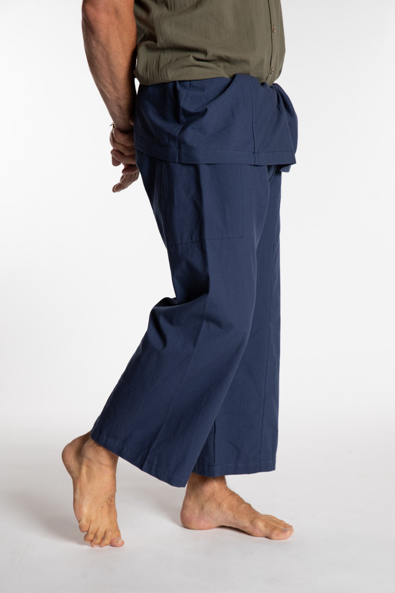 Topher is wearing the Dark Blue Thai Fisherman Pocket Pants 