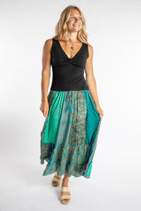 Sophie is wearing size S/M Women's Tank Top in Black with blue patchwork skirt