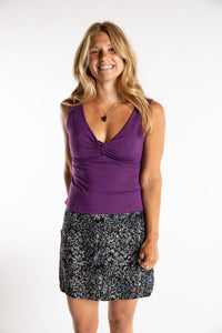 Sophie is wearing size S/M Women's Tank Top in Purple with batik skirt