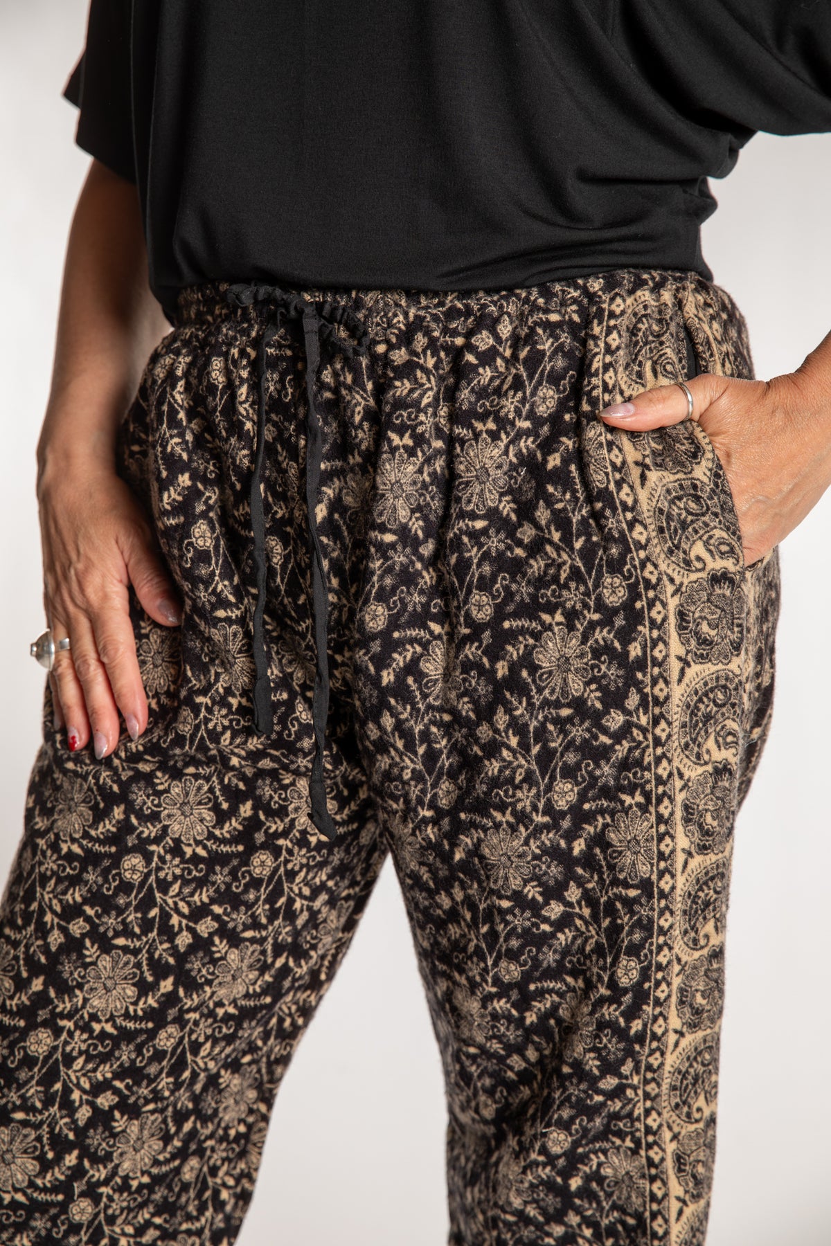 Susan is wearing the L/XL Veda Soft Brushed Pants in Black