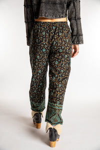Sophie is wearing the S/M Veda Soft Brushed Pants in Black and Blue