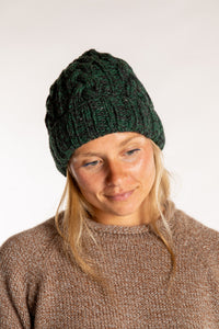 Sophie is wearing the Wharfside Cable Knit Wool Beanie in Forest Green 