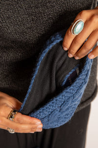 Sophie is wearing the Wharfside Cable Knit Wool Headband in Blue