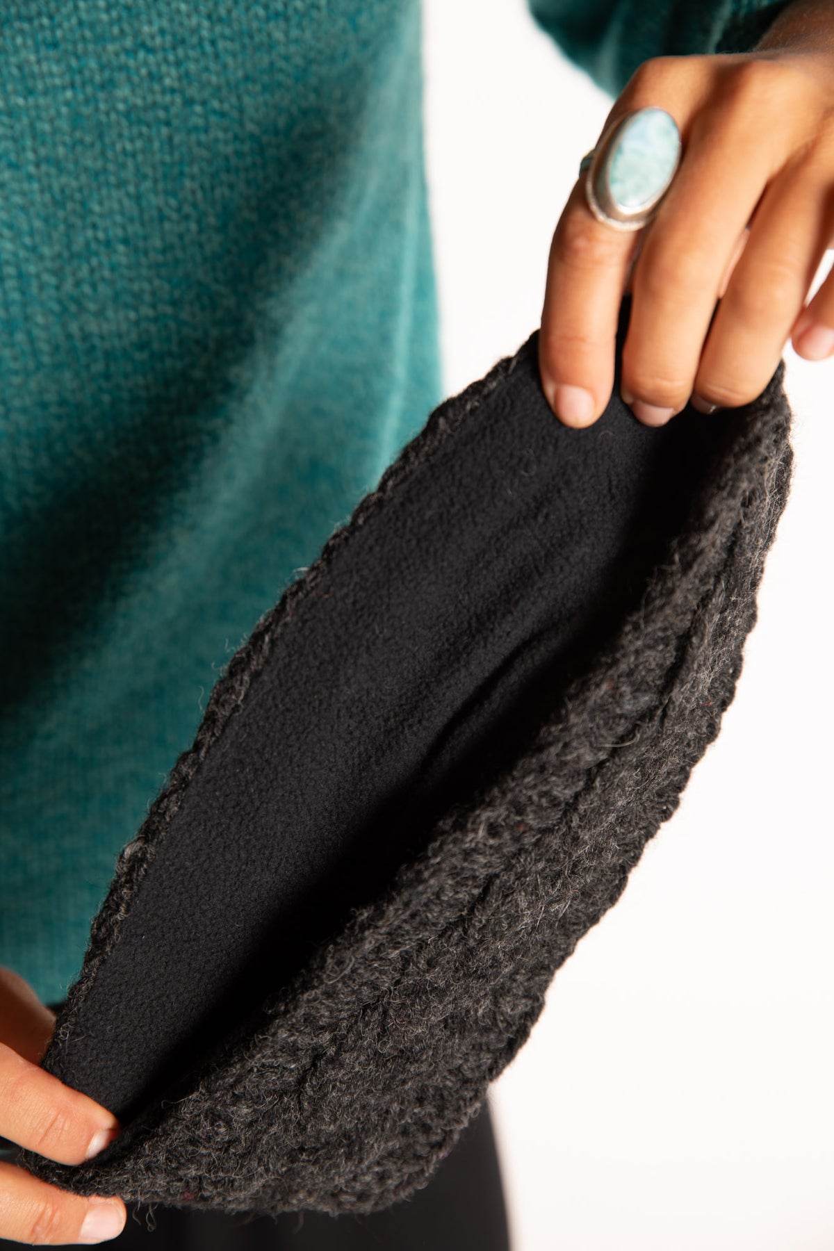 Sophie is wearing the Wharfside Cable Knit Wool Headband in Charcoal