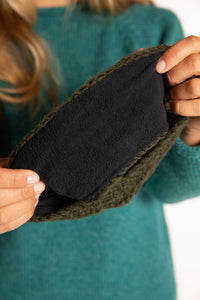 Sophie is wearing the Wharfside Cable Knit Wool Headband in Olive