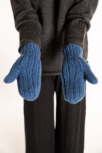 Sophie is wearing the Wharfside Cable Knit Wool Mittens in Blue