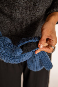 Sophie is wearing the Wharfside Cable Knit Wool Mittens in Blue