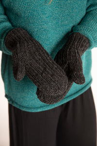 Sophie is wearing the Wharfside Cable Knit Wool Mittens in Charcoal