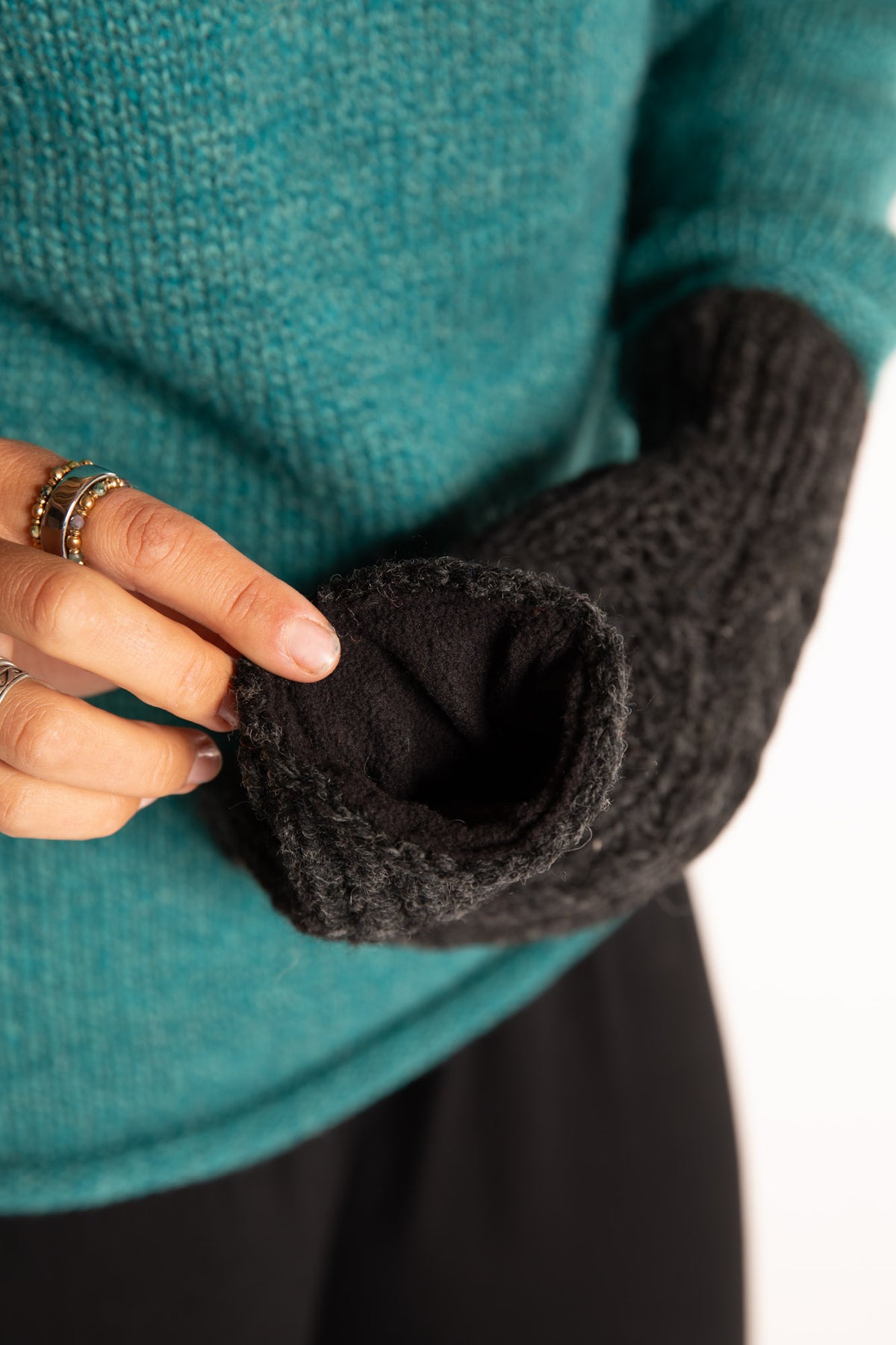 Sophie is wearing the Wharfside Cable Knit Wool Mittens in Charcoal