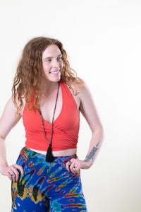 Carly is wearing size S wrap top in coral