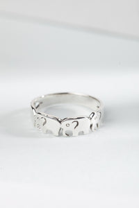 sterling silver elephant parade ring with elephant band design
