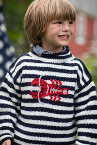 Phoenix is wearing a kids lobster sweater