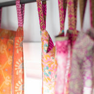 close up of the hanging tabs of recycled silk panel curtains