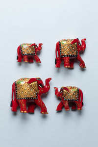 Wooden hand painted elephant family in red